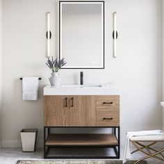 a bathroom with a sink, mirror and stool