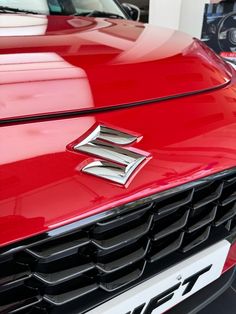 the front end of a red sports car