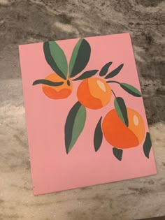 an orange painting on a pink background with green leaves and two oranges hanging from the tree