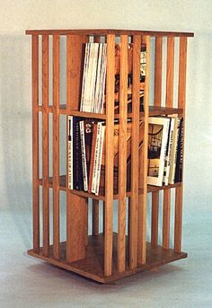 a bookshelf made out of wood with multiple compartments