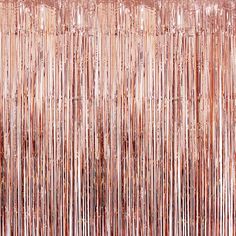 a pink background with metallic foil fringes