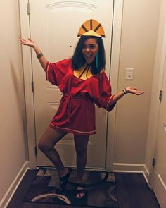 a woman in a red dress is posing for the camera with her arms outstretched and hands out