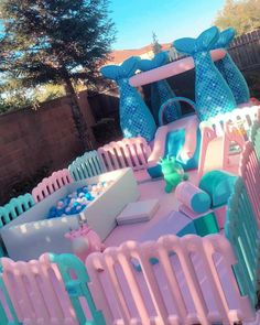 a pink and blue inflatable play area