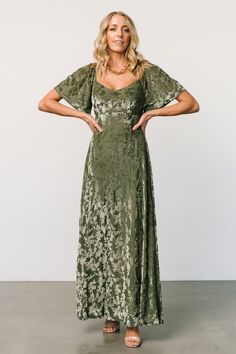 Discover timeless elegance with our Dark Sage long dress featuring a flattering neckline, short flutter sleeves, and a luxurious velvet floral pattern. This dress effortlessly combines sophistication and femininity, making it a stunning choice for any formal event or evening affair. Maxi Dress Dark, Fitted Maxi Skirt, Dark Sage, Baltic Born, Velvet Maxi, Velvet Maxi Dress, Green Bridesmaid Dresses, Flowy Shorts, Chiffon Material