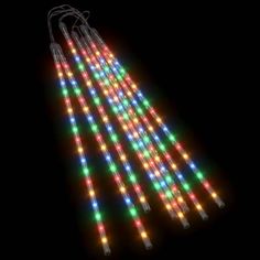 an array of multicolored lights in the dark with one light on each side