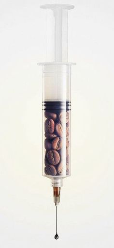 a coffee bean dispenser hanging from a hook with the words cafe bake below it