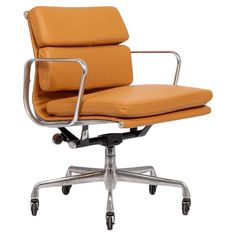 an orange office chair with chrome frame and leather upholstered seat, viewed from the front