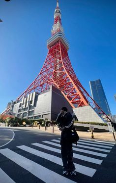 a man standing in front of the eiffel tower