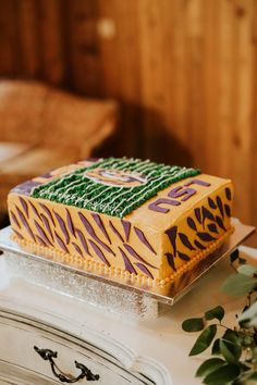 a decorated cake sitting on top of a table