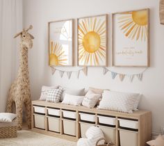 a room with two giraffes hanging on the wall and several storage bins