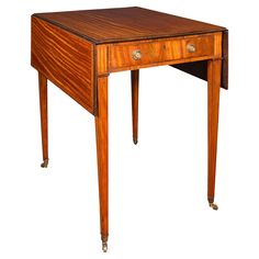 an antique wooden desk with two drawers on one side and a drawer on the other