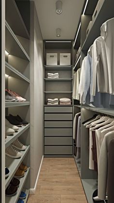 a walk in closet with lots of clothes and shoes on the shelves next to it