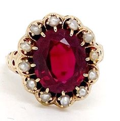 Lady's vintage synthetic ruby, pearl and yellow gold ring.  Beautiful piece with a seed pearl halo accenting an oval cut synthetic sapphire center measuring approximately 13mm x 10mm. This piece weighs approximately 4.4 grams and has tested 14K and the ring size is approximately 8 ½. It is in great condition and would make a beautiful addition to your vintage jewelry collection. Etsy Gold Ring, Seed Pearl, Yellow Gold Rings, Rings Statement, Antique Jewelry, Ruby, Halo, Heart Ring, Statement Rings