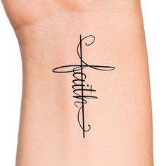 a wrist tattoo with the word faith on it