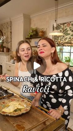 two women standing in a kitchen preparing food on top of a wooden cutting board with the words spinach and ricotta ravioli