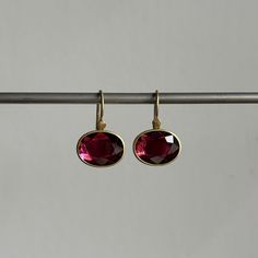 Warm, twinkling garnets are complemented by balmy yellow gold settings in this gorgeous pair. 18k yellow gold Garnet, 7.37ctw, 12mm x 9mm (1/2" x 3/8")Earrings hang 13/16" from the ear Each earring weighs 2.5g Sequin Earrings, Newport Ri, Yellow Gold Setting, Gift Card Shop, Bracelet Gift, Ring Necklace, Newport, Jewelry Care, Ring Earrings