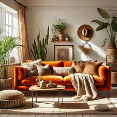 a living room with an orange couch and potted plants on the wall next to it