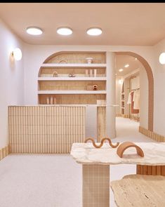 an empty room with wooden tables and shelves