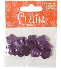 purple buttons with floral designs on them are packaged in a package for $ 3 99