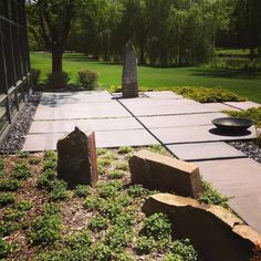 an outdoor area with rocks and grass in the foreground