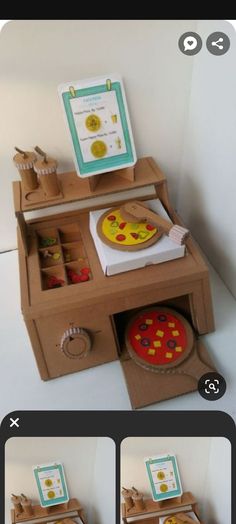 an image of a wooden toy kitchen with pizza on the stove and other items in it