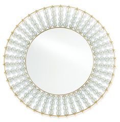 a round mirror with pearls on it