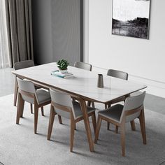 a dining room table with chairs around it