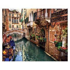 a gondola is on the side of a narrow canal in venice, italy