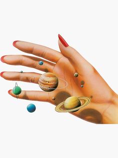 a person's hand with several different planets in the middle and on top of it