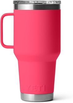 a bright pink yeti cup with a stainless steel lid sits on a white surface