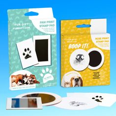 the dog paw print stamp pad is next to its box and it's packaging