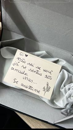 an open box with a note attached to it