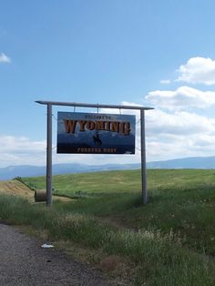 a sign for wyoming on the side of a road