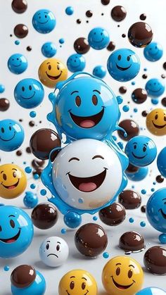 many different colored balls and smiley faces floating in the air