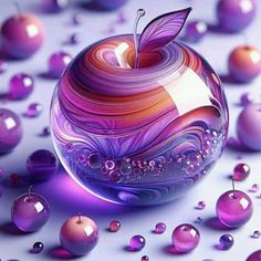 an apple with a butterfly on it surrounded by purple and pink balls, all in the same pattern