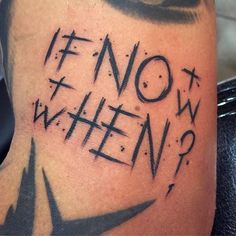 a man's leg with the words now and then written in black ink on it