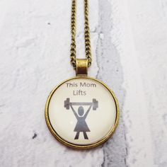 This handmade fitness necklace is the definition of girls who lift in a pendant, you can be fit and strong and lift heavy but still be feminine, click for options You can also be a mom who lifts, a gym rat, a fitness freak and yet still be feminine if you want to be, this necklace is fun and pretty but carries a strong message. The pendant graphics are designed by me using a graphic design package , in high resolution and printed on a good quality photographic paper in order to create a lasting Gym Rat Gift, Team Unity, Fitness Jewelry, Medical Jewelry, Graphic Design Packaging, Motivational Gifts, Girls Who Lift, Gym Rat, Bag Tags