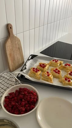 raspberry shortbreads are on a baking sheet and ready to go into the oven