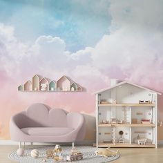 there is a doll house in the corner of this room with pink furniture and clouds painted on the wall