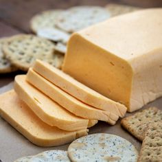 crackers and cheese are arranged on a table