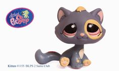 the littlest pet shop kitty figurine is sitting down