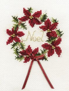 a cross stitch christmas wreath with poinsettis and the word noel written on it