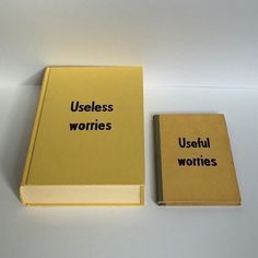 two books with words written on them sitting next to each other in front of a white background