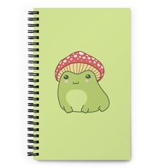 a spiral notebook with a cartoon character wearing a mushroom hat