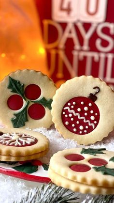 christmas cookies decorated with holly and red berries