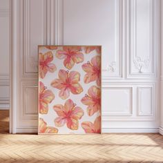 an empty room with a painting on the wall and wood flooring in front of it