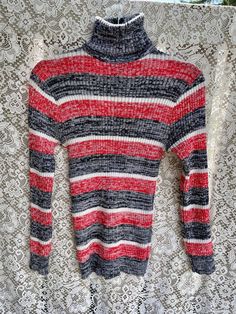 1960 1970 Vintage Striped turtleneck sweater, reminds me of "That 70s Show" Great condition, tag says size L Measurements: Shoulders-17" Pit to pit 18"  Bottom hem 18" length- 28" Shaulder to bottom sleeve - 23" Retro Ribbed Winter Tops, Vintage Turtleneck Tops For Fall, Retro Turtleneck Sweater For Spring, Vintage Turtleneck Tops For Winter, Striped Long Sleeve Turtleneck For Winter, Vintage Stretch Sweater For Winter, Retro Long Sleeve Ribbed Sweater, Vintage Turtleneck Winter Tops, Spring Retro Turtleneck Sweater