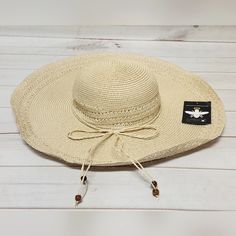 *New With Tags *Inner Band: Approx. 18.5" *Brim: Approx. 5.31"W *Crown: Approx. 4.72"H *Fit: Fitted: Slightly More Relaxed Than A Close Fit; Still Outlines Figure But Not Tightly *Content: 100% Paper *Fabrication: Woven Paper Straw *Embellishment/Trim: Braided Self-Fabric Tie Around Base Of Crown With Beaded Ends *Style: Floppy Sun Hat *Crown: Round *Brim: Wide, Flat Floppy *Interior: Grosgrain Fabric Headband *Stay Away From The Rays In This Oversized Straw Hat, Featuring A Wide, Floppy Brim Pe Lightweight Beach Hat For Beachwear, Lightweight Beachwear Hat For Beach, Lightweight Beachwear Hats For Beach Season, Casual Adjustable Hat For Beach Season, Lightweight Wide Brim Sun Hat One Size, Lightweight Cream Straw Hat For The Beach, Lightweight Cream Straw Hat For Beach, Lightweight Wide Brim Sun Hat, Lightweight Adjustable Hat For Beach