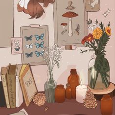 there are many vases with flowers in them on the table next to books and pictures