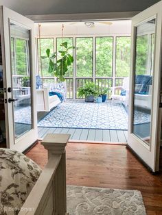 the inside of a house with patio doors open